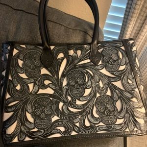 Western purse new without tags, with sugar skulls and leather tool work